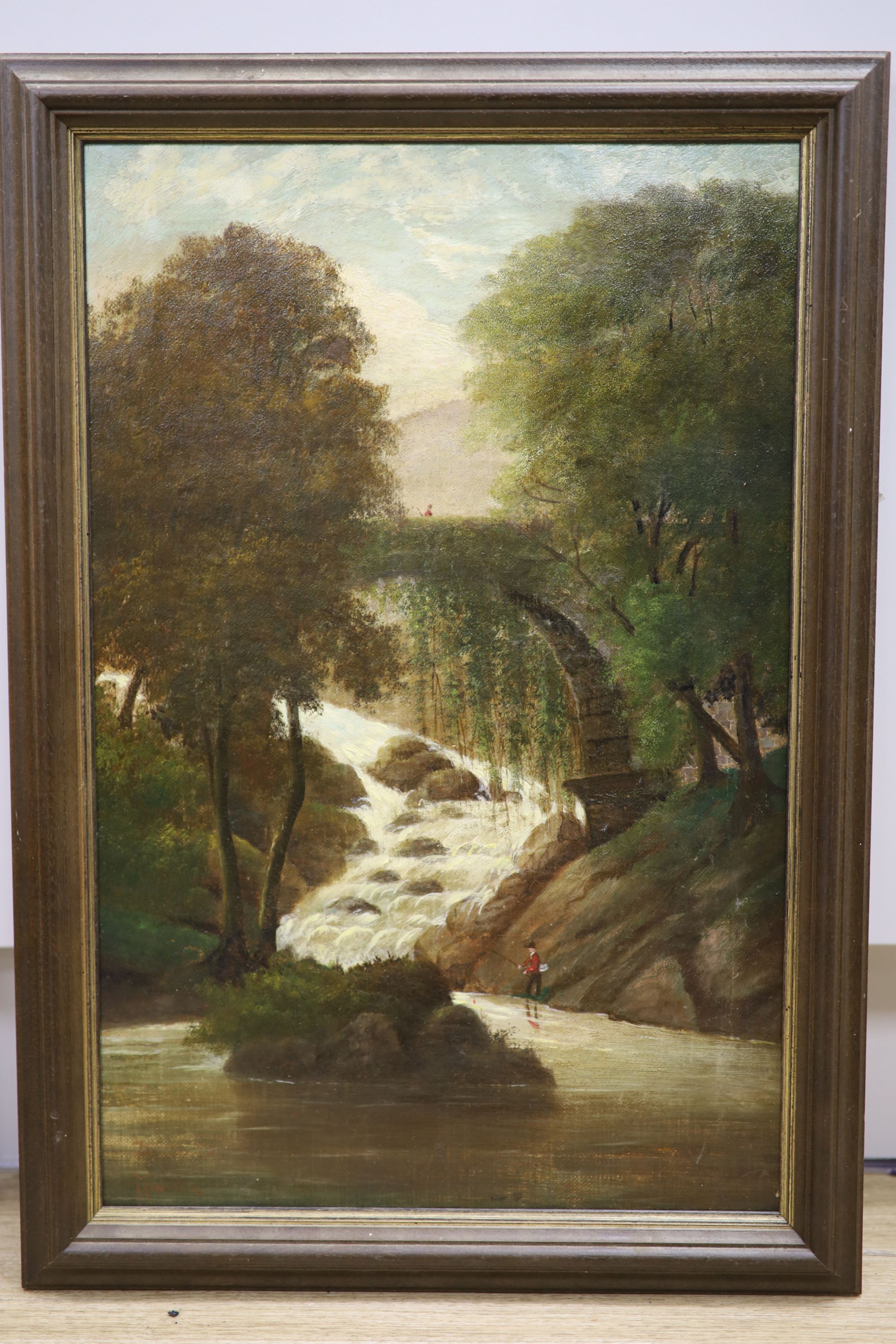 English School circa 1900. Oil on canvas Angler in a Welsh river landscape, indistinctly signed, 51 x 33 cm.